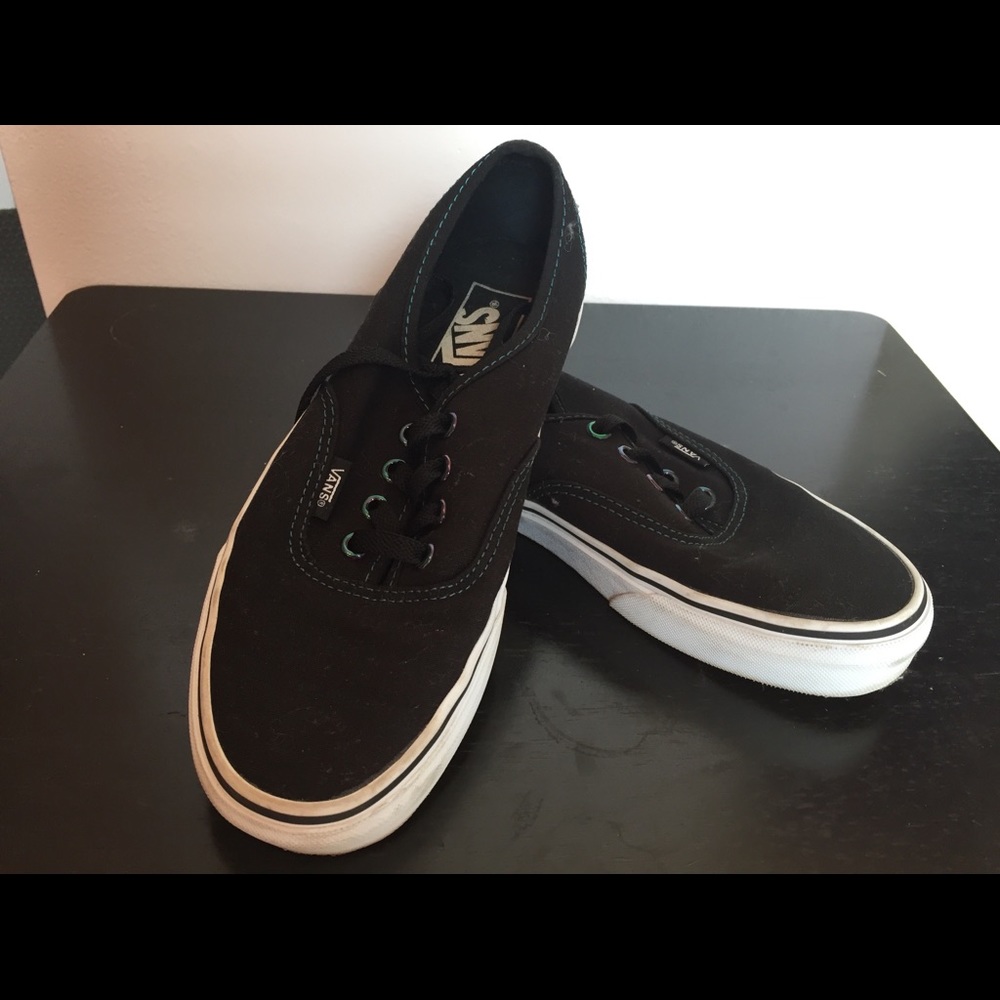 Vans with multicolored shoelace holes
